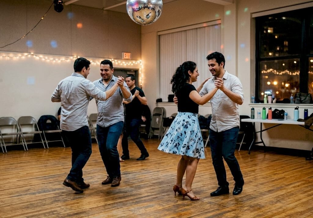 Salsa dancers at upbeat social event